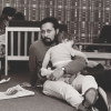 Stuart Hall holding a baby 